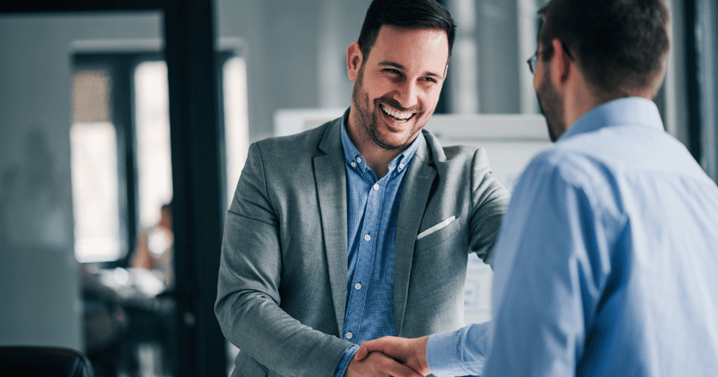 Two business people shaking hands