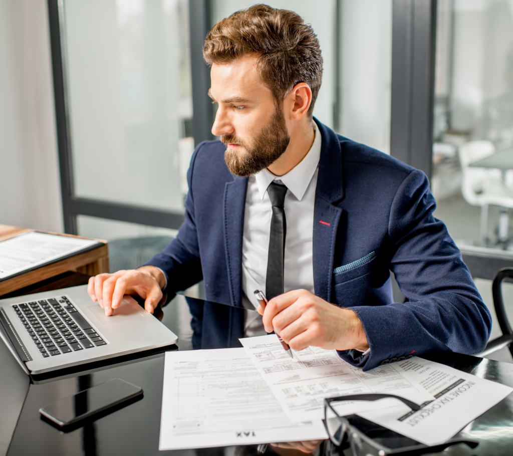 Male accountant filing taxes